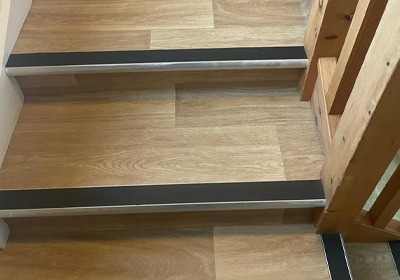 Bullnose stair nosing installed on modern wooden staircase